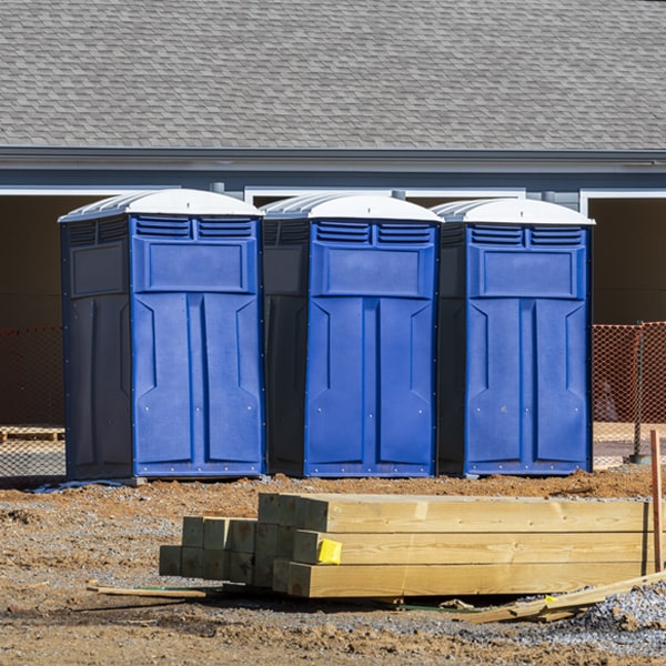 what is the cost difference between standard and deluxe portable toilet rentals in Vinemont